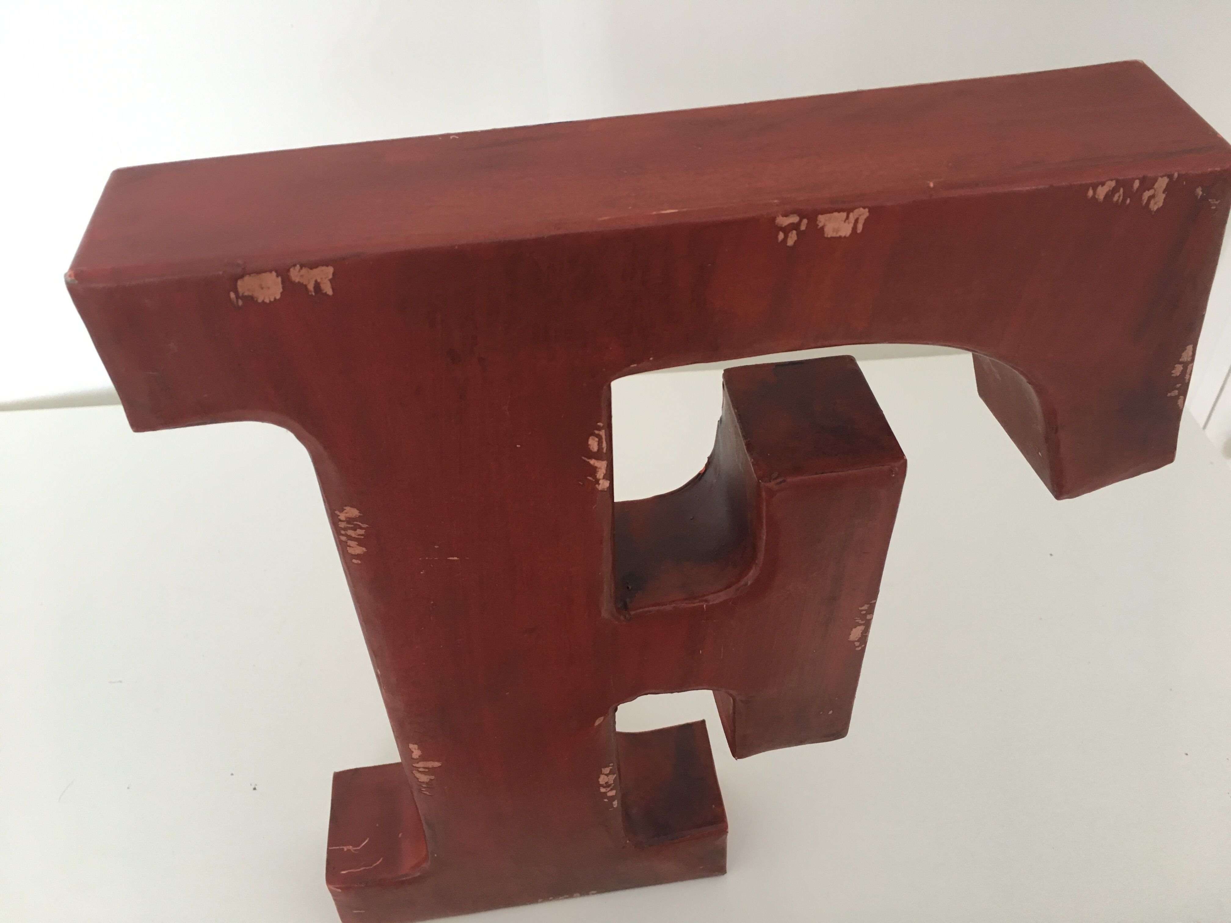 Red metal "F" sign letter