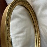 Oval wall mirror in baroque gilded plaster frame 29x20cm