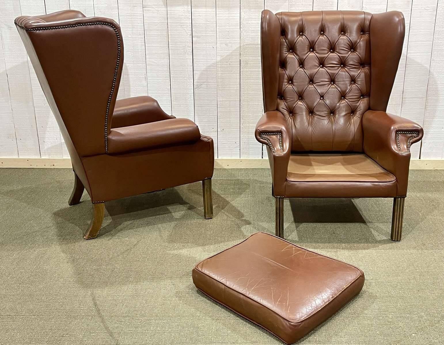 Pair of brown leather wingback Chesterfield armchairs from the 1970s.