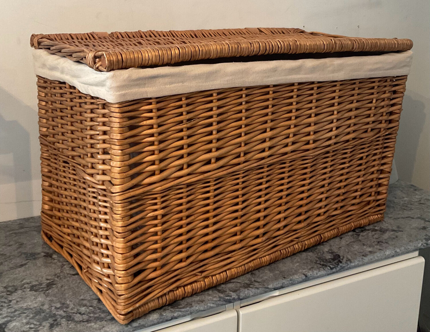 Woven wicker vintage suitcase