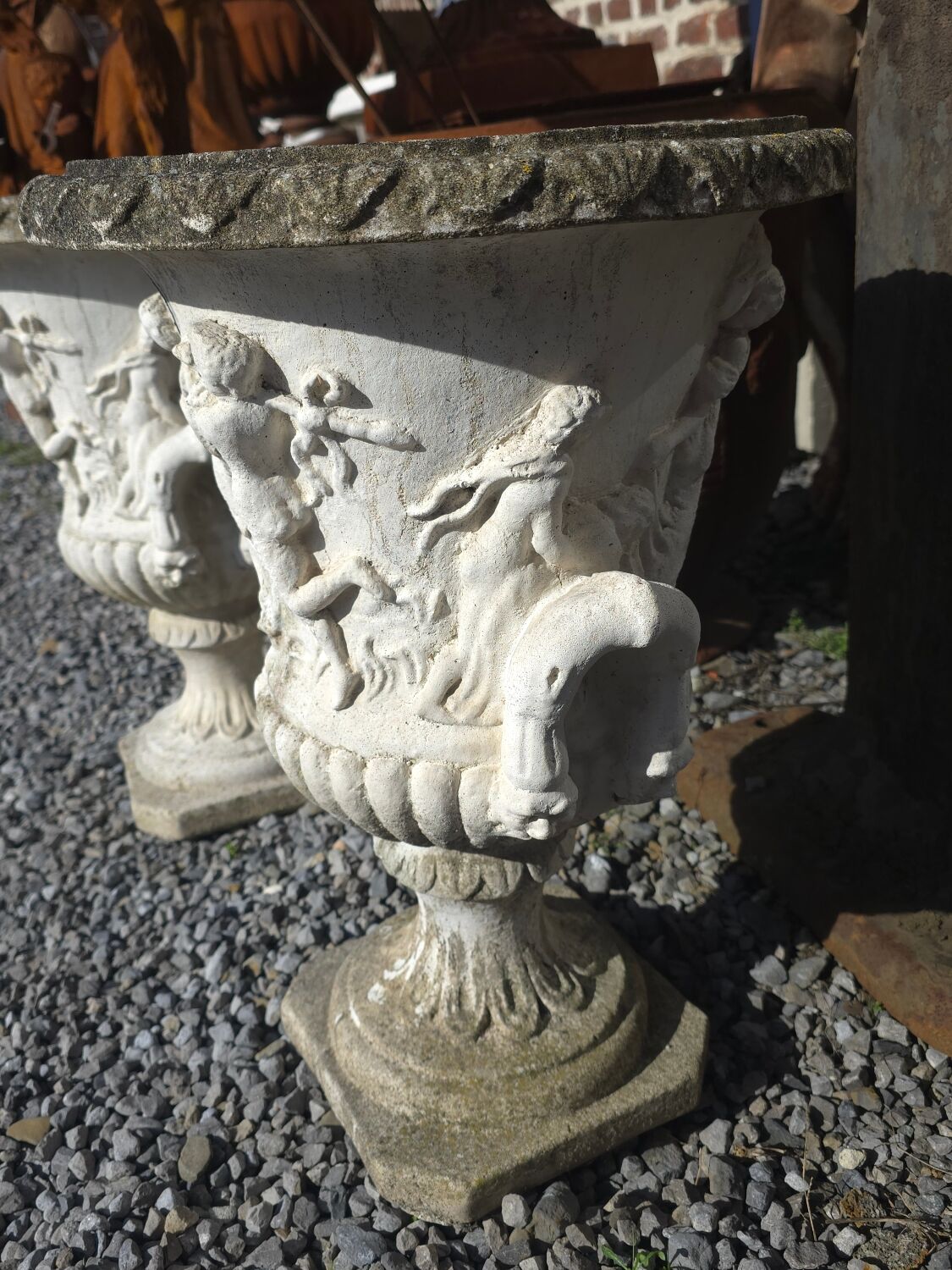 Medical vases with characters in reconstituted stone.