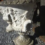 Medical vases with characters in reconstituted stone.