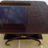 Chic serving table on wheels from the 60s with brass decorations and two shelves.