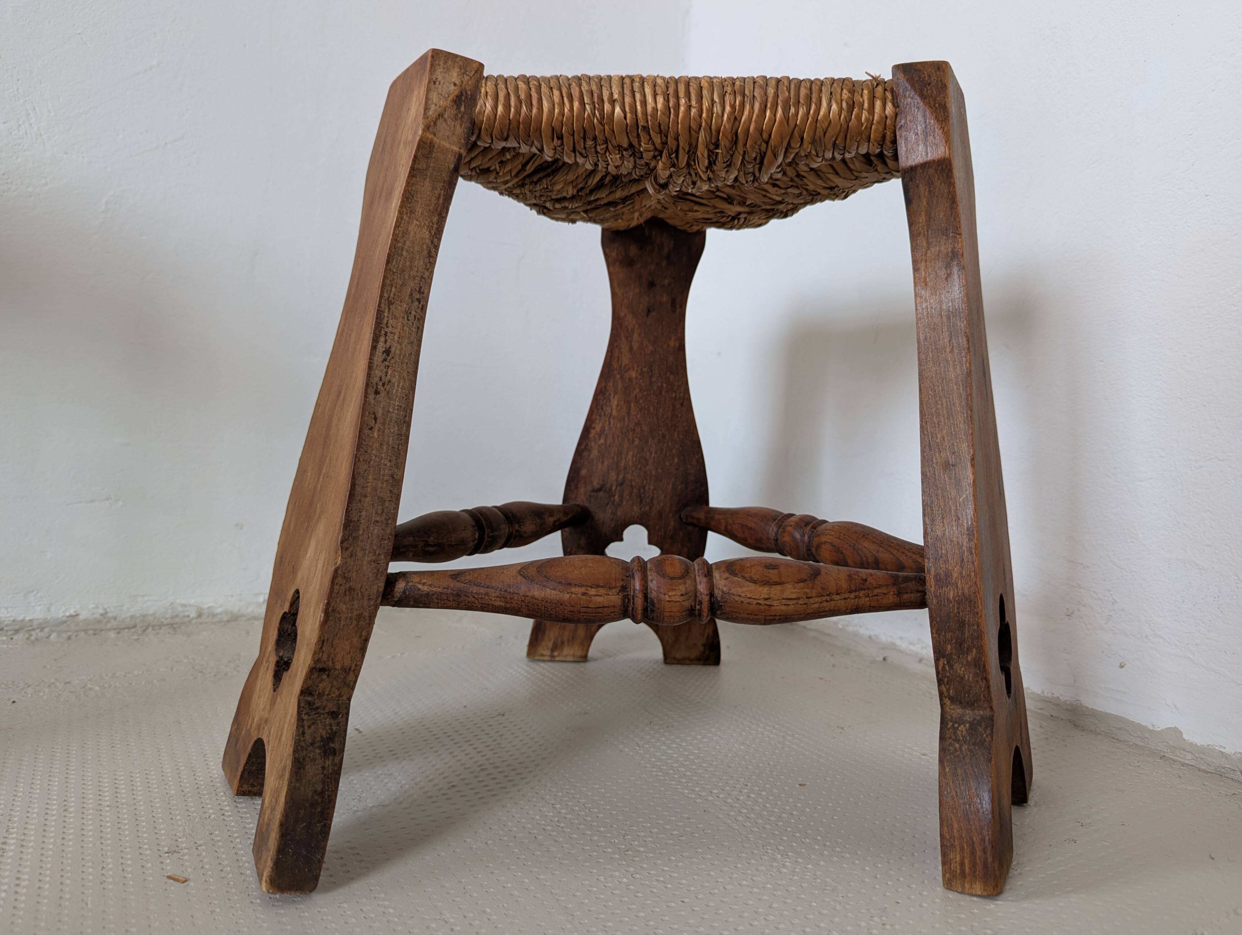 Low tripod farm stool in wood and straw