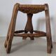 Low tripod farm stool in wood and straw