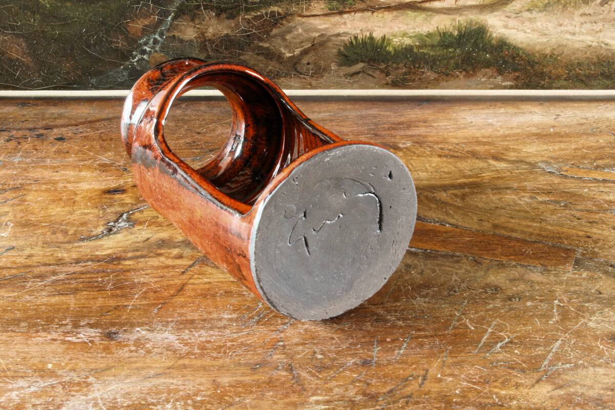 Signed orange ceramic candle holder and jug