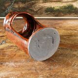 Signed orange ceramic candle holder and jug