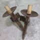 Pair of brutalist wall sconces in hammered and patinated iron, work from the years.