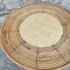 Round dessert bar in rattan and vinyl braided straw way
