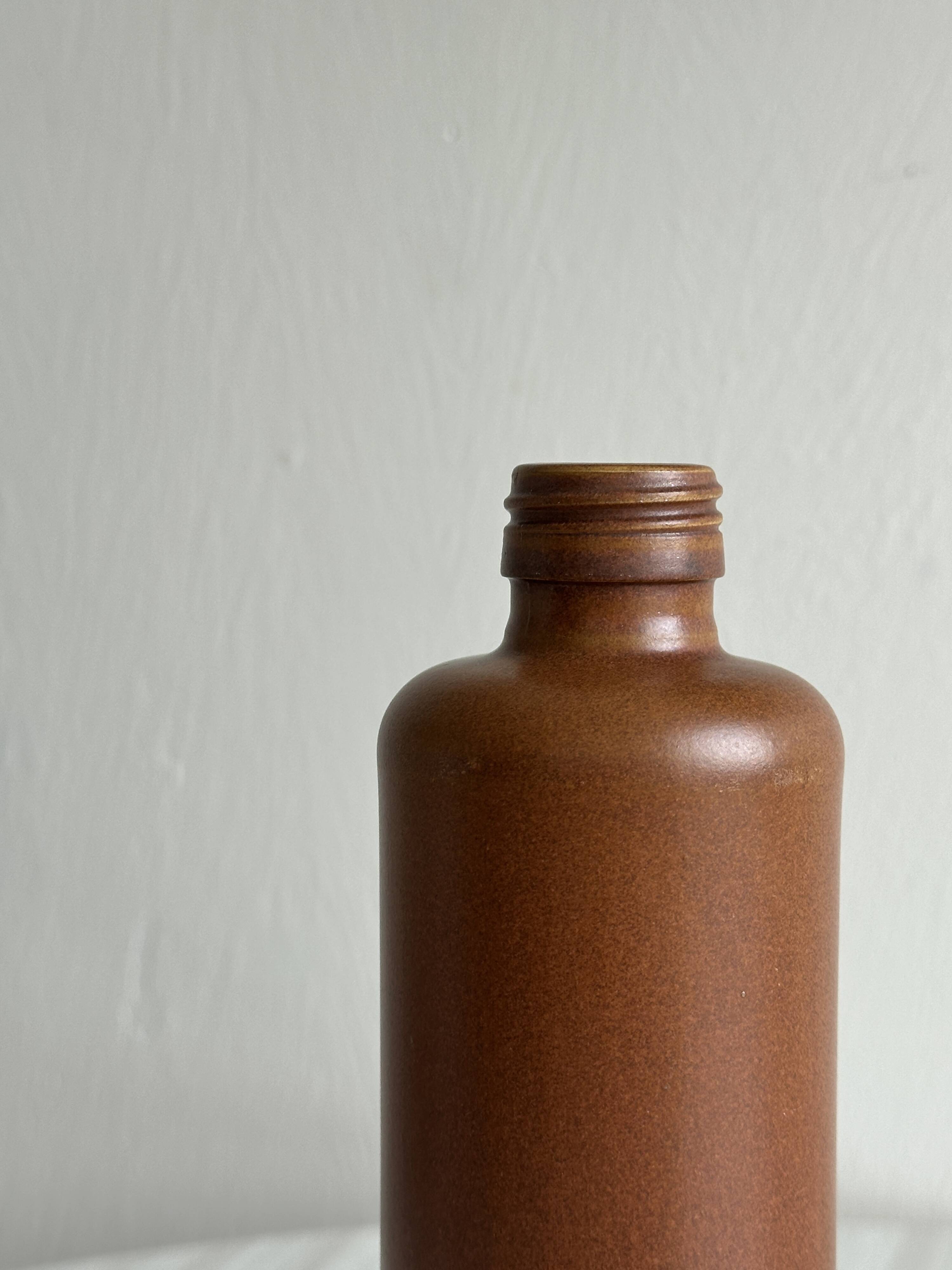 Decorative brown ceramic bottle.