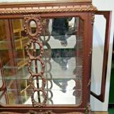 A Louis XV style display cabinet with three beechwood shelves and a white marble top.