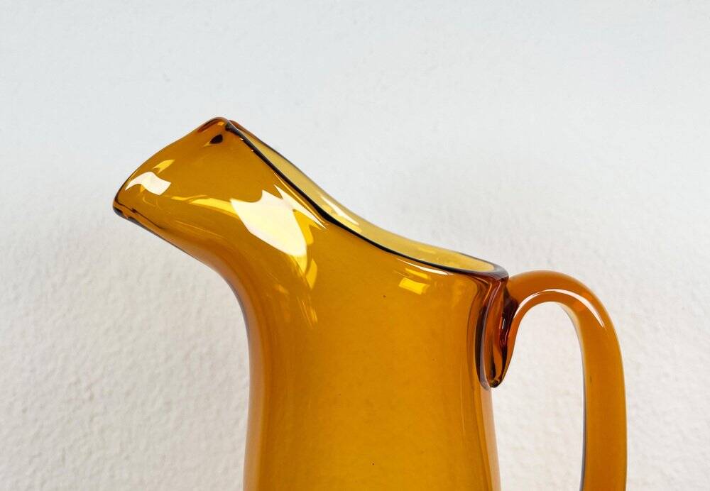 Amber glass carafe from the mid-century German Jagdhaus series and drinking glasses by Wilhelm Braun-Feldweg for Hirschberg, 1960s, set of 7.