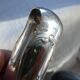 Christofle Silver-plated metal sugar tongs with crossed ribbon bow design