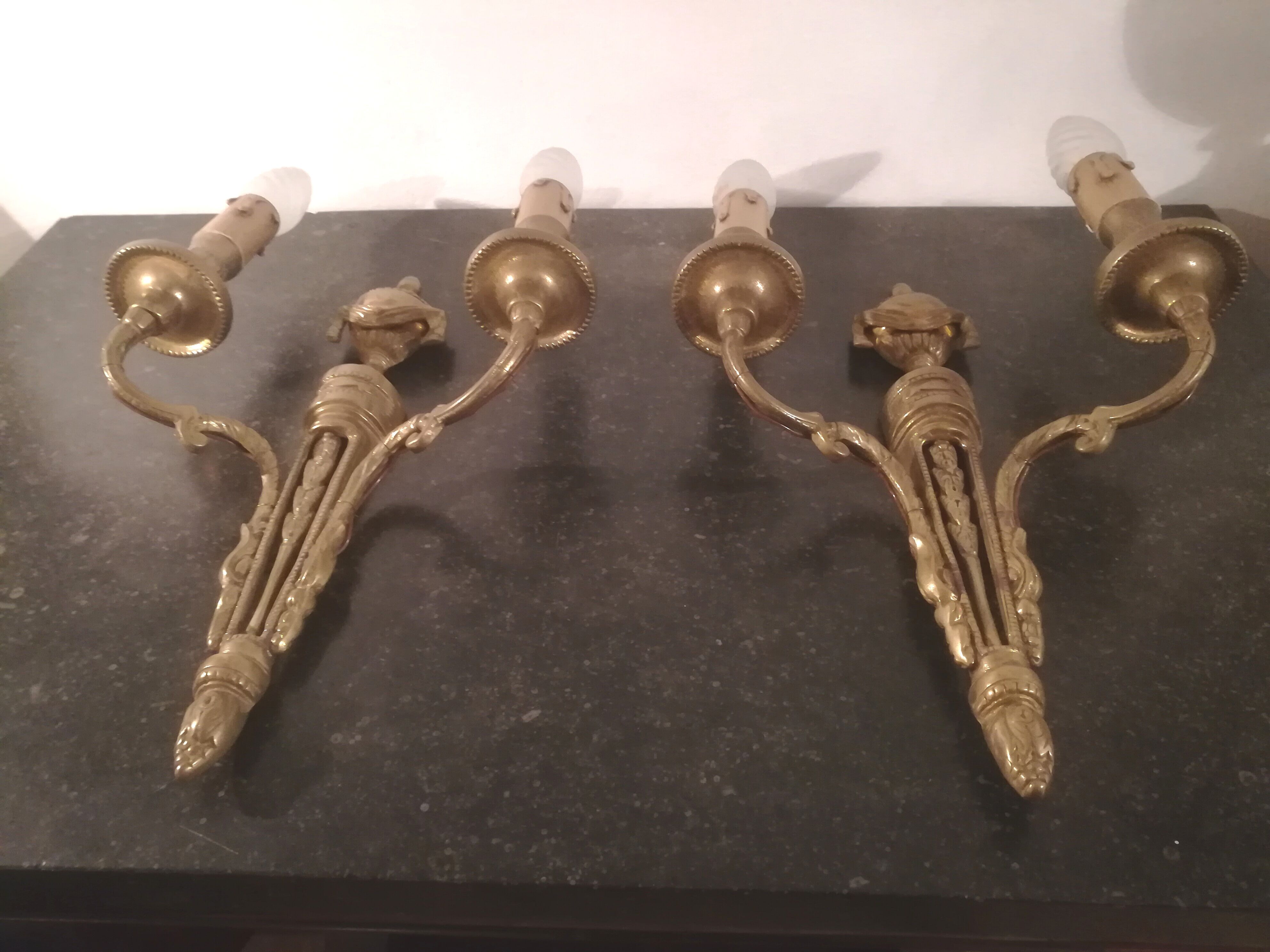 Pair of Louis XVI style sconces in gilded bronze