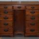 Small Victorian desk in solid walnut with drawers.