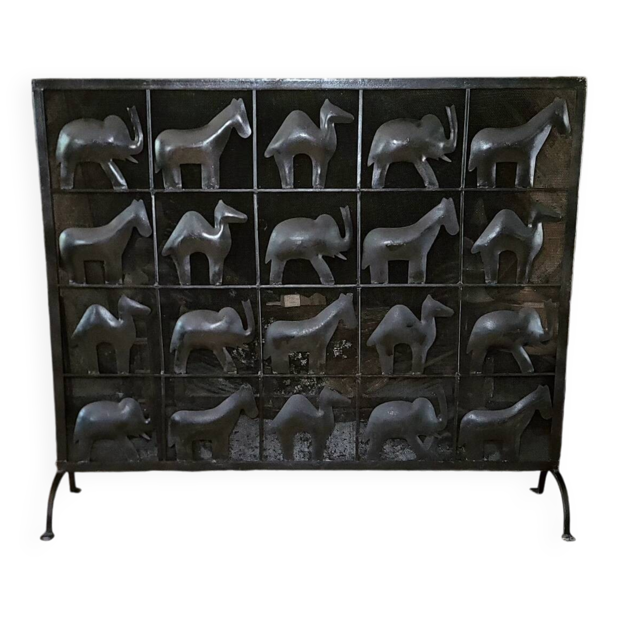 Black metal firewall decorated with animals