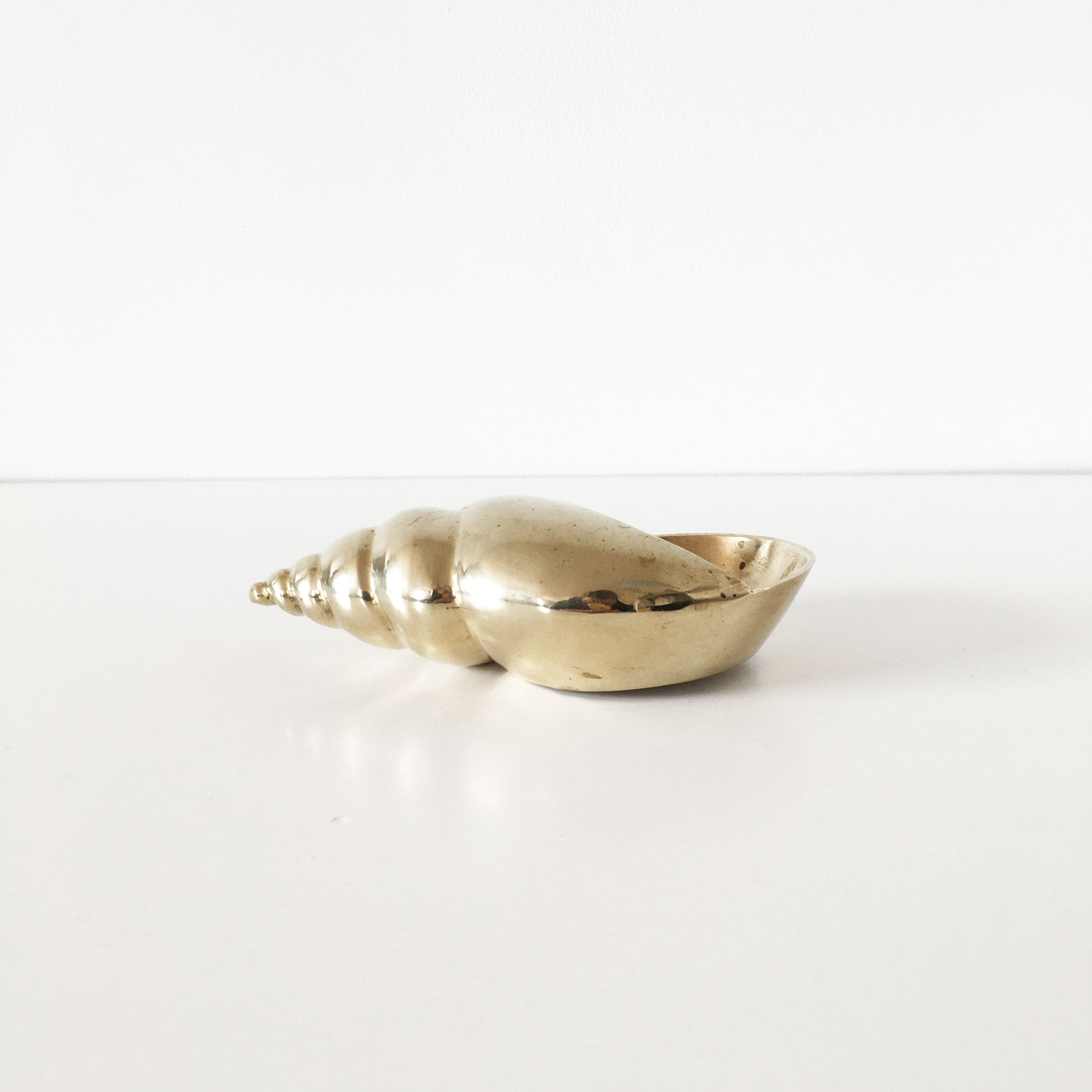 Vintage brass shell ashtray