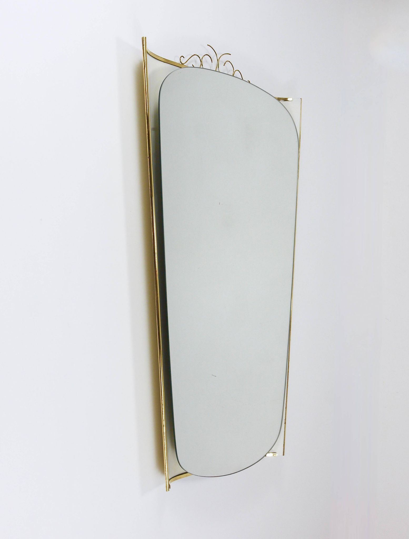 Mid-century illuminated wall mirror by Ernest Igl with brass crown, by Hillebrand.