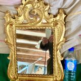 Carved and gilded wooden mirror with mercury ice sheet, Louis XV XVIIIth
