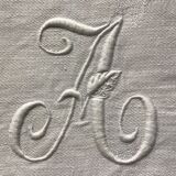 Tablecloth and 12 linen towels marked AA