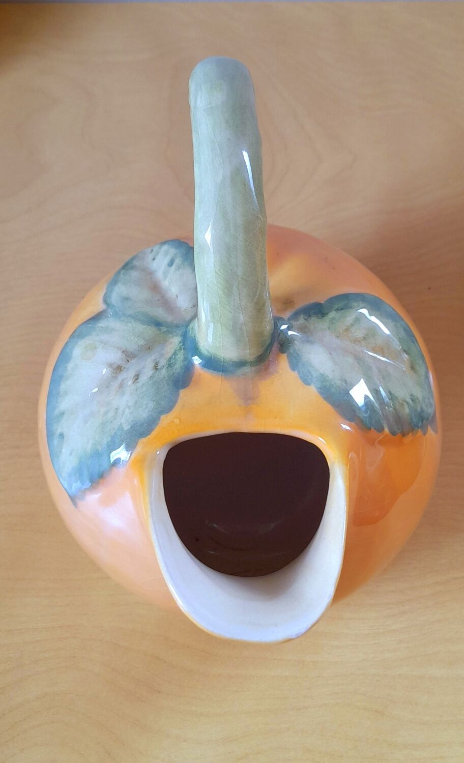 Orange pitcher in slip