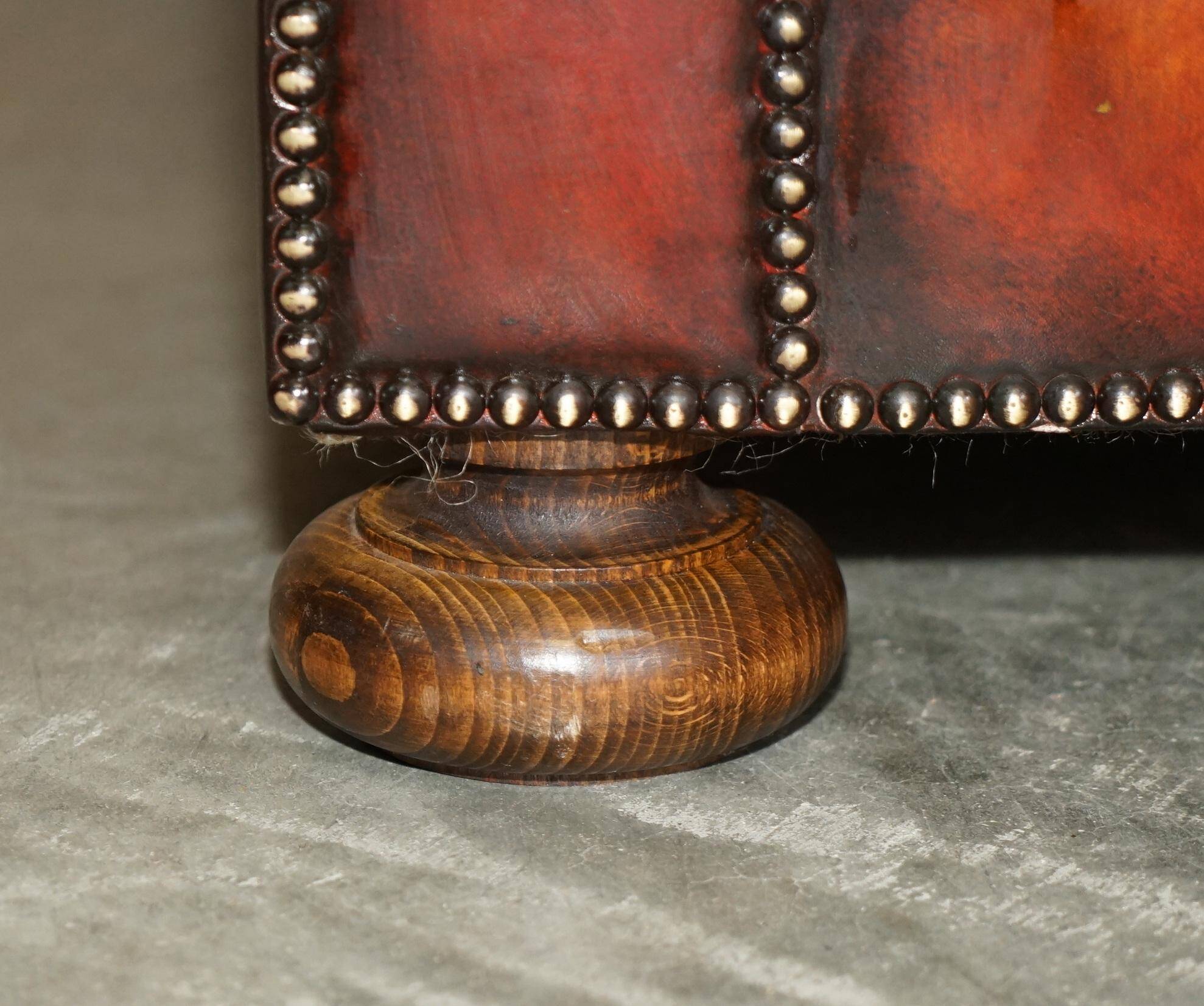 Pair of restored antique Chesterfield sofas in Boudreaux leather.