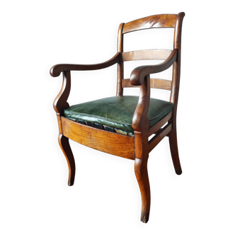 Old armchair with aged leather seat