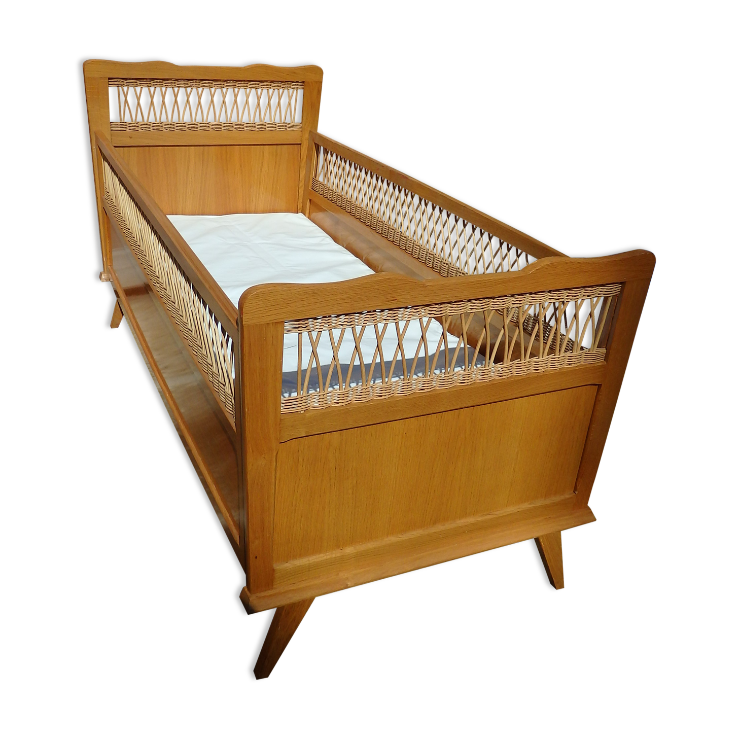 Vintage baby bed in rattan