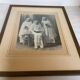 Large frame old photograph of a trio of communicants.