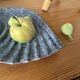 Shell-shaped ceramic catchall.