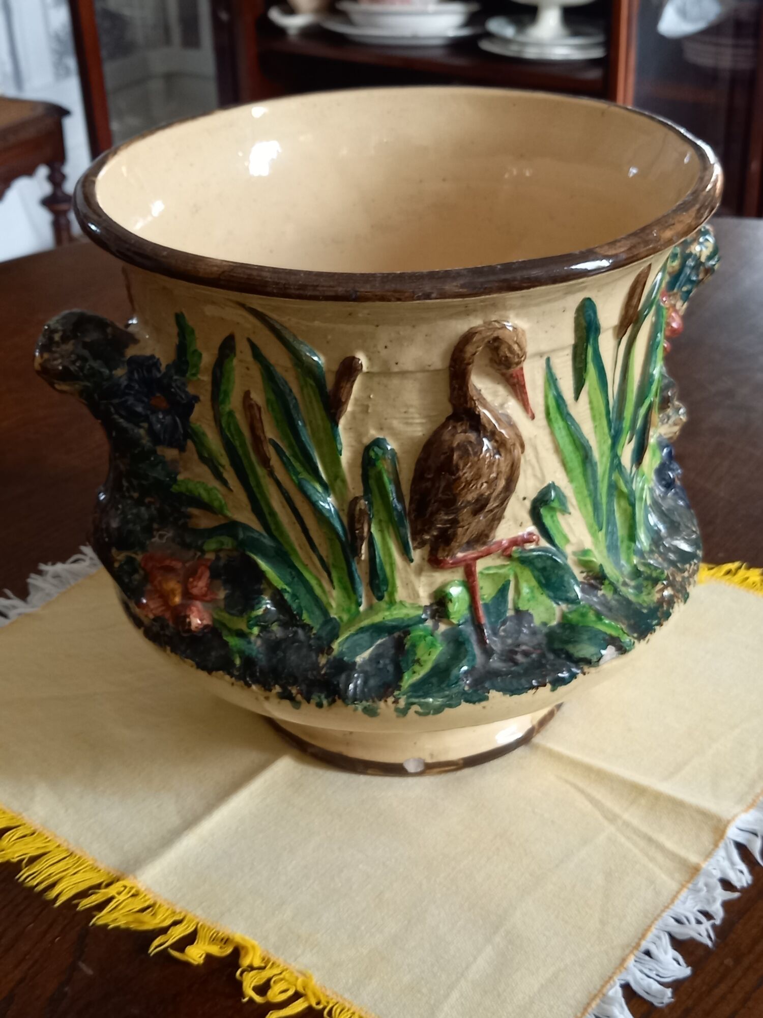 Pot cover in slip pattern birds small shine on brown border of the foot