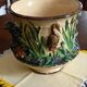 Pot cover in slip pattern birds small shine on brown border of the foot