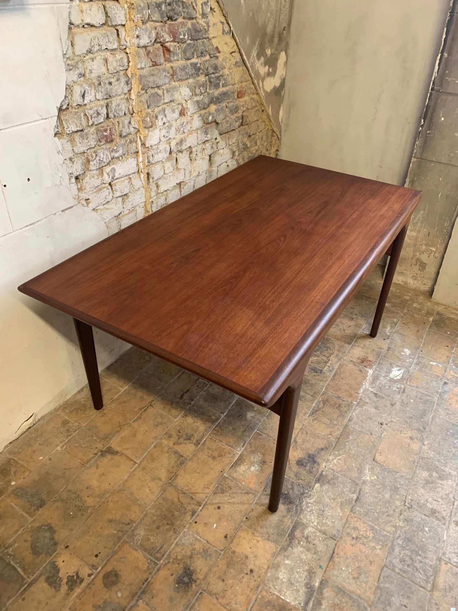 Dark teak dining table by Johannes Andersen for Uldum Møbelfabrik, Denmark