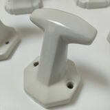 Five art deco white porcelain hooks