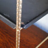 Shelf wall metal string