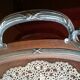 Serving platter in wood, glass, and Brussels lace