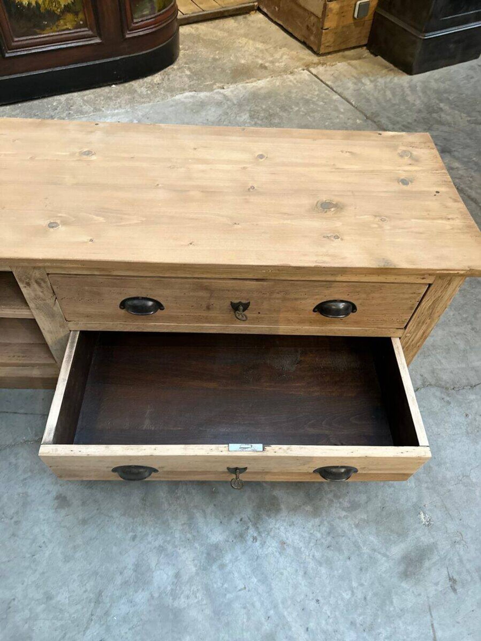 An old piece of workshop furniture transformed into a TV stand