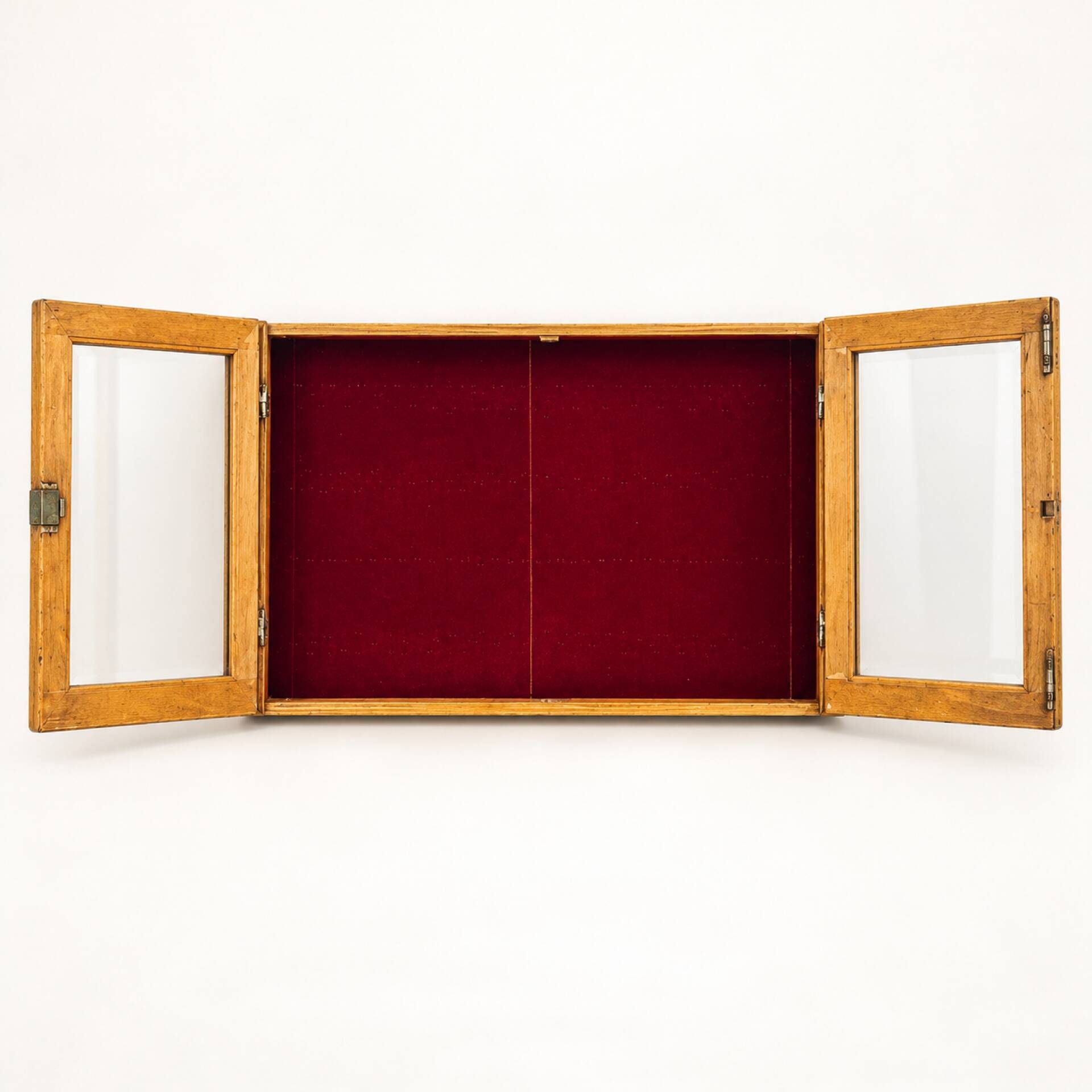 Vintage wall display cabinet in moulded wood and glass – burgundy background