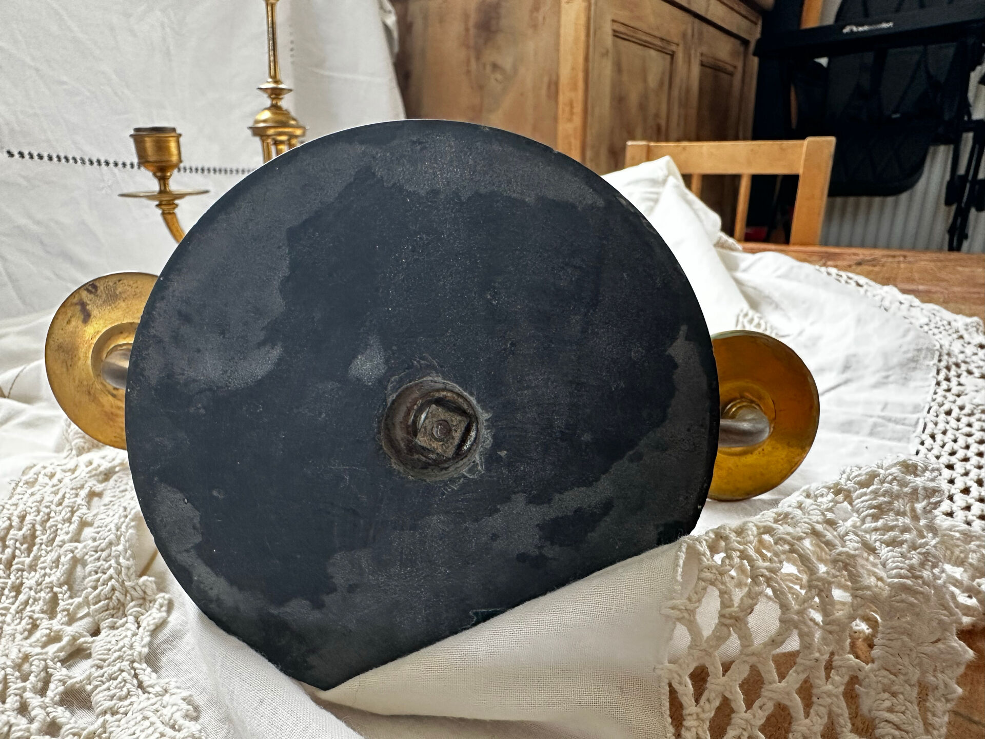 Pair of Empire style candlesticks, patinated brass and black stone.