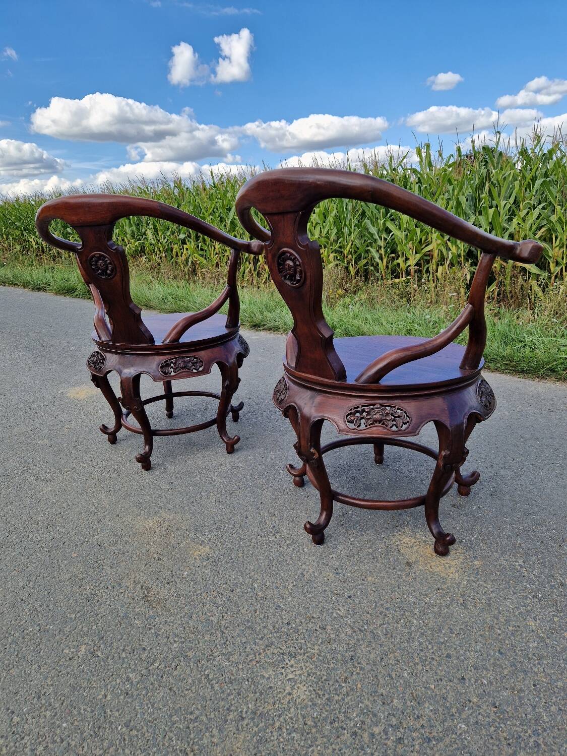 Pair of antique Chinese carved mahogany armchairs, circa 1960s