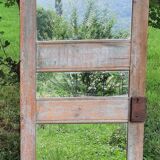 Mirror (3 panels) on door.