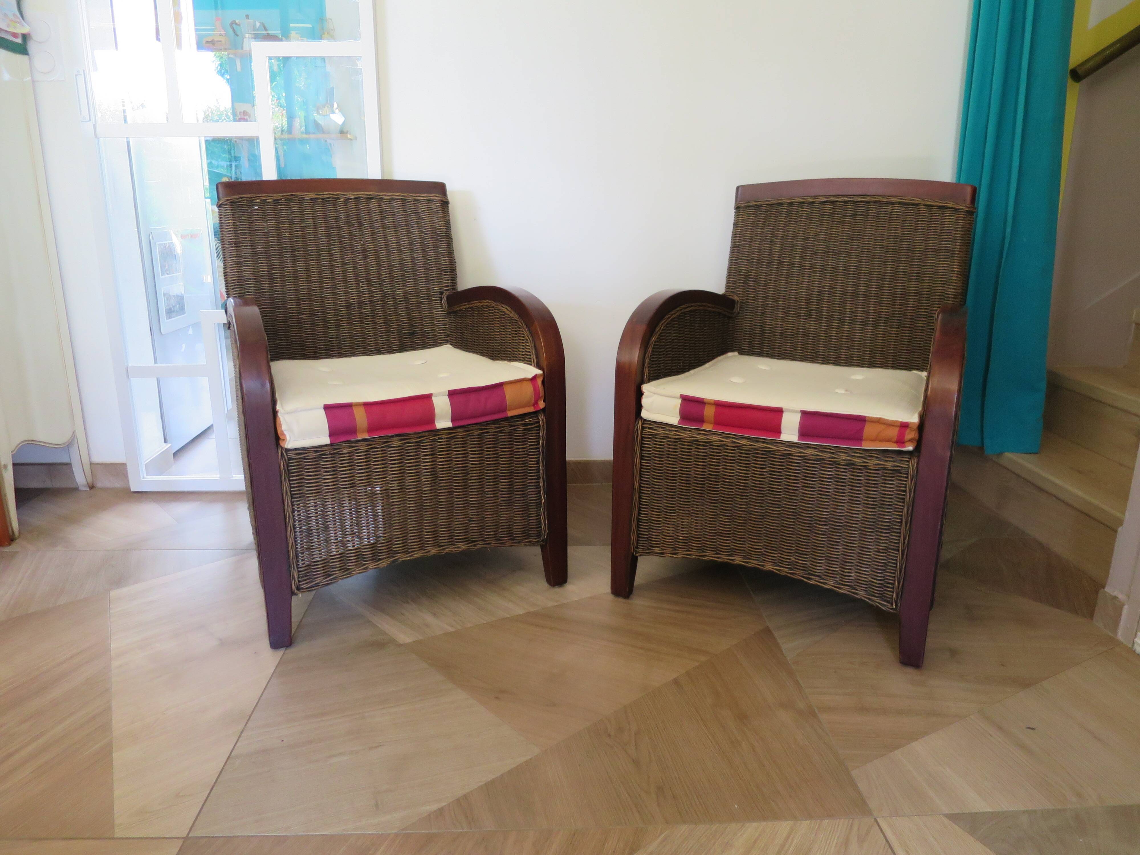 2 armchairs in woven rattan and wood, 1980s