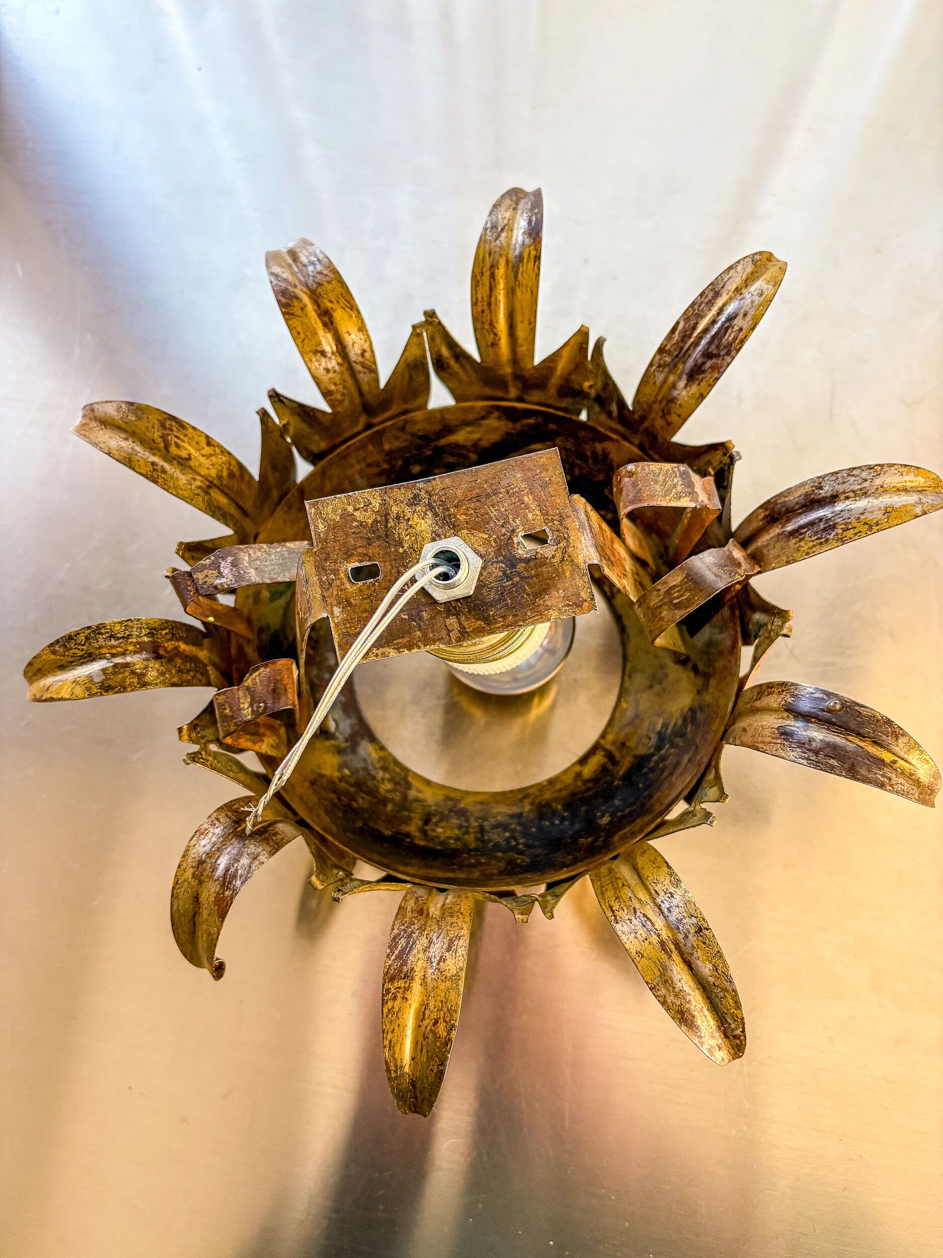 Sunburst ceiling light fixture or sconce in gilt wrought iron, Spain, 1960s