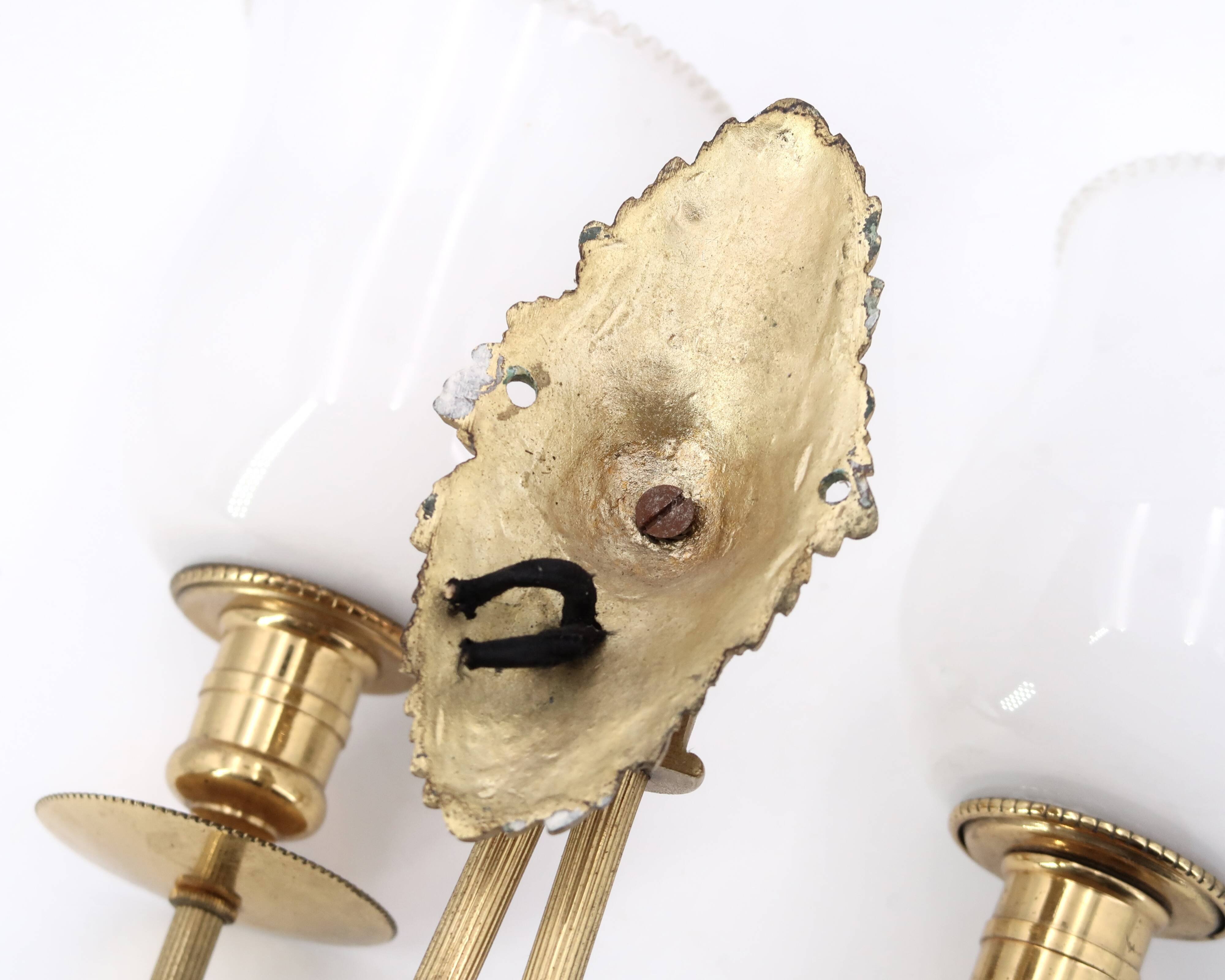 Three wall lights in brass and opaque glass, 1950s