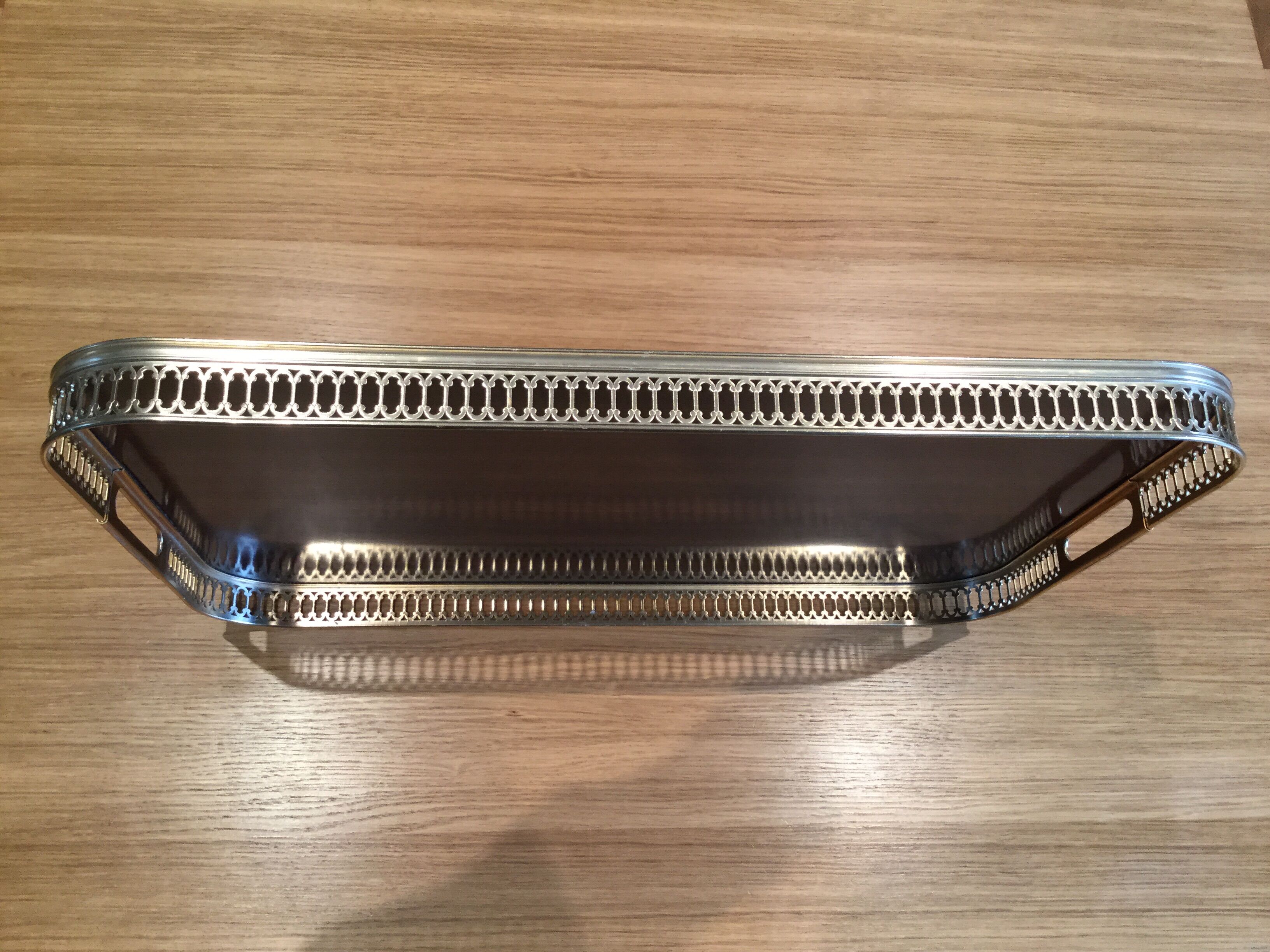 Vintage brass platter and imitation wood veneer from the 1950s