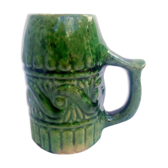 Green ceramic cup with decorations