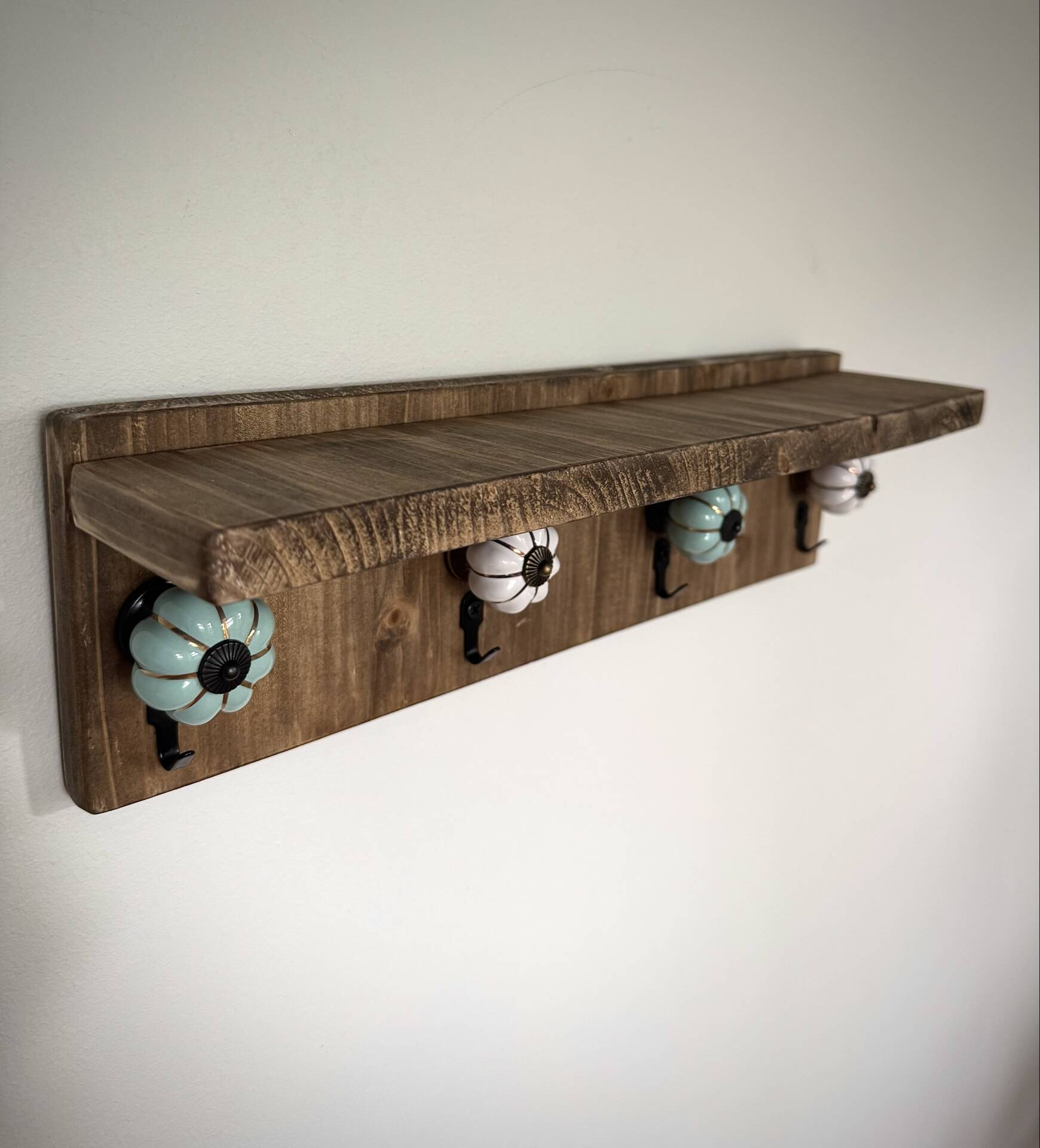 Wooden key holder shelf with hooks and ceramic knobs