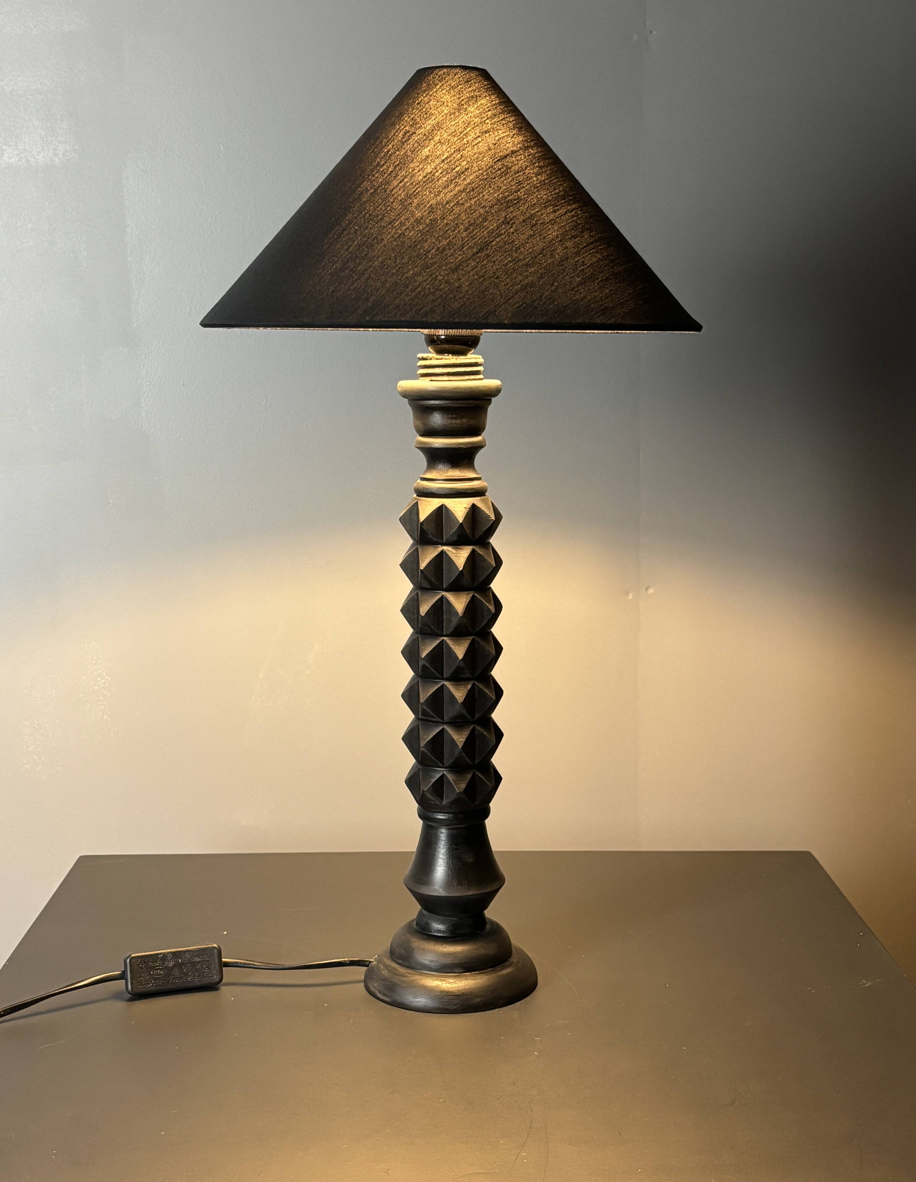 Brutalist wood turned ebonized table lamp in the style of Charles Dudouyt