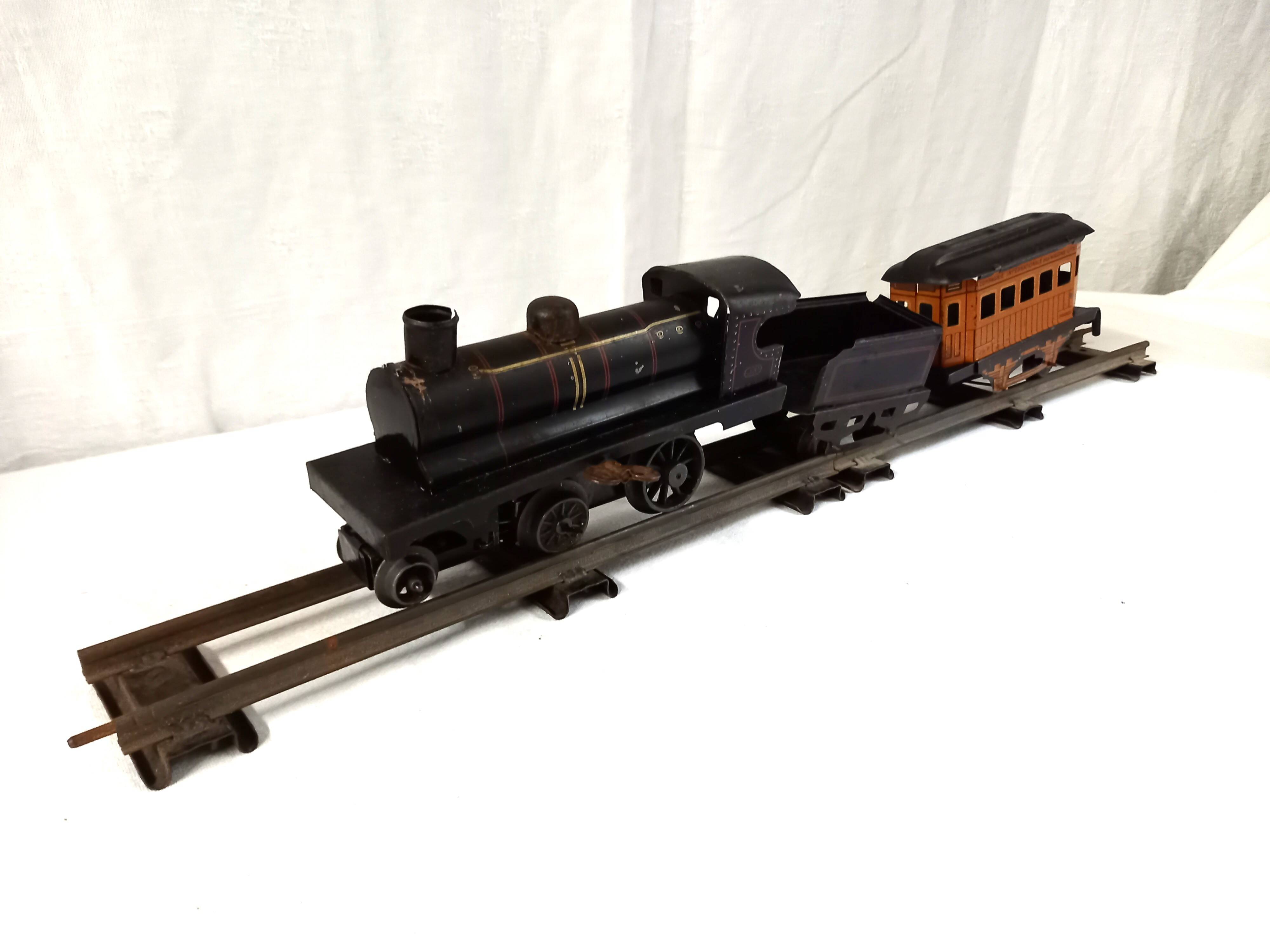 Small JEP mechanical train, including locomotive, tender, sleeping car, rail, 1930s