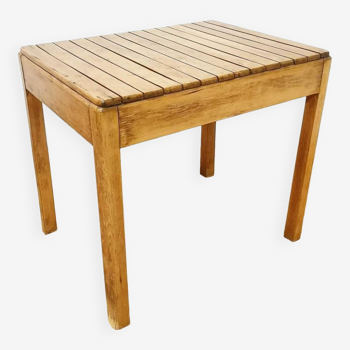 Small wooden slatted dining table